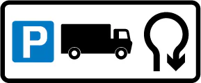 Direction to a lorry park via a U-turn at a roundabout ahead