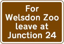 Exit from a motorway at a junction ahead that should be used for a tourist attraction