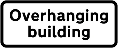 Reduced headroom over part of road due to overhanging building ahead